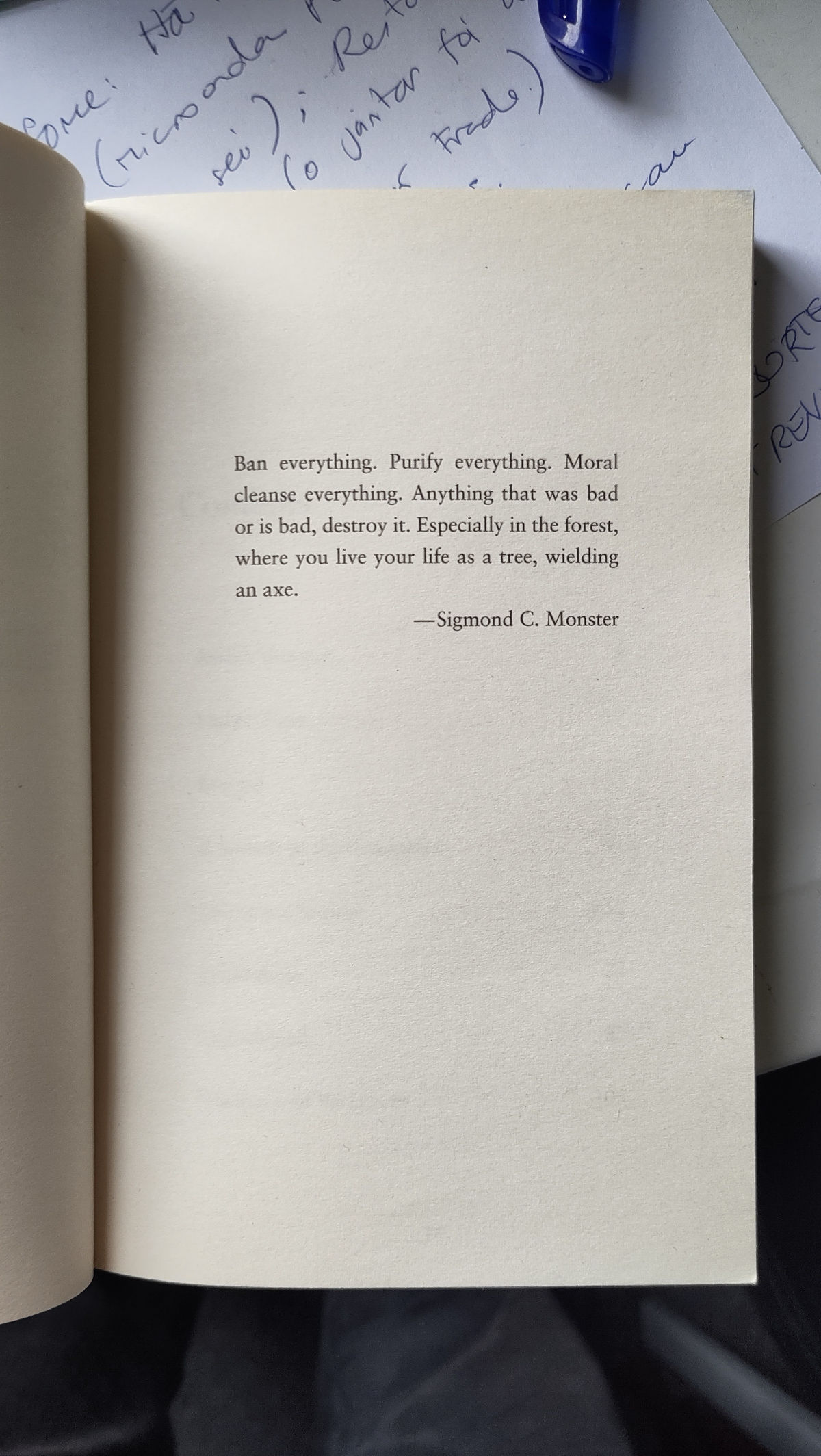 The novel Happy-Go-Lucky is open on a page containing its epigraph.